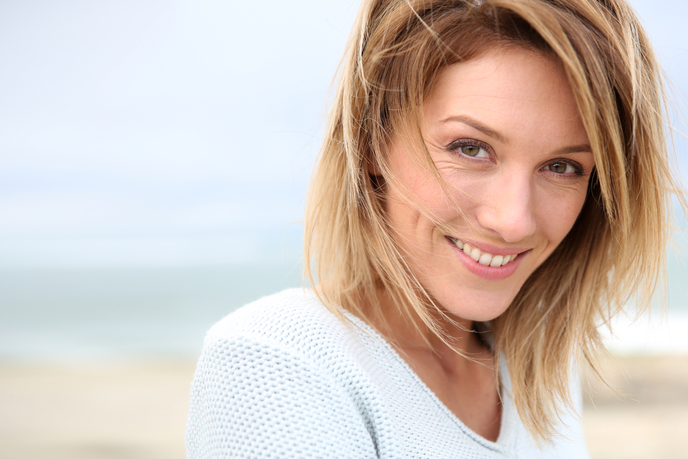 woman smiling at the beach