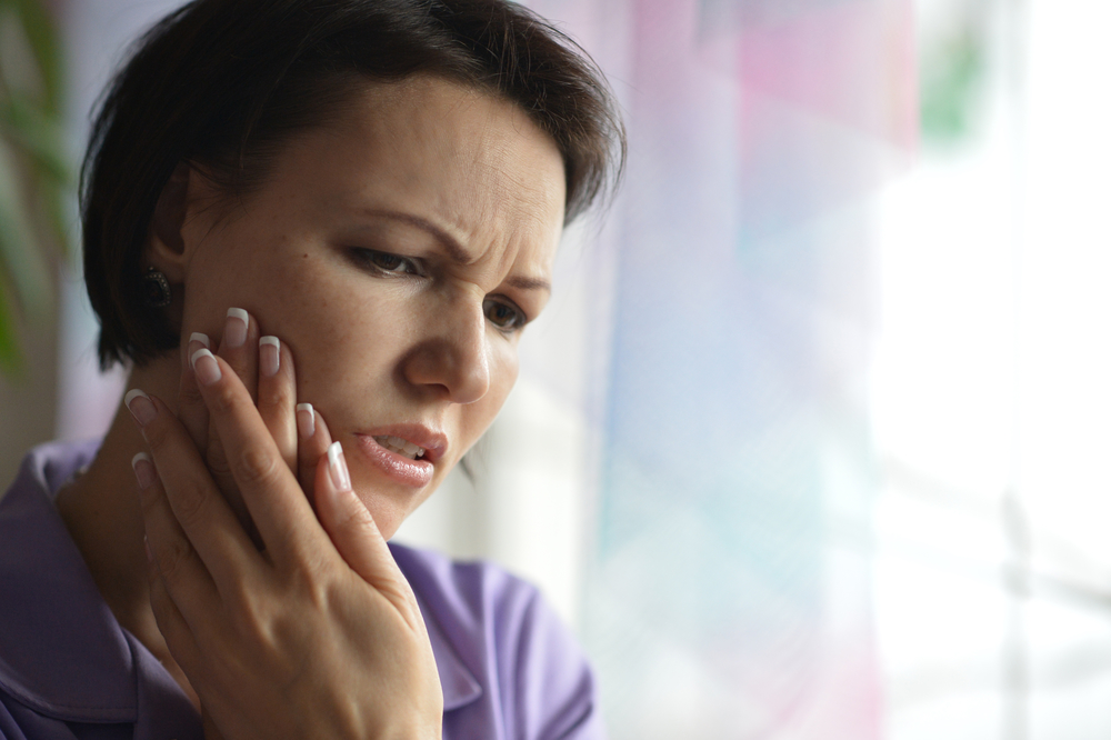 woman with tooth pain