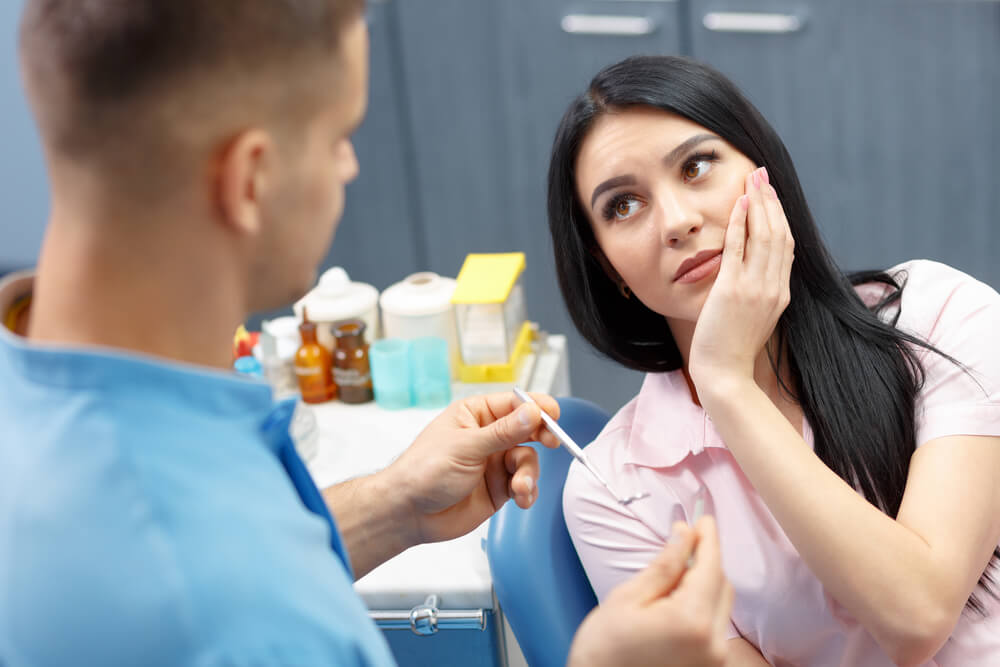 woman preparing for a root canal at the dentist's office