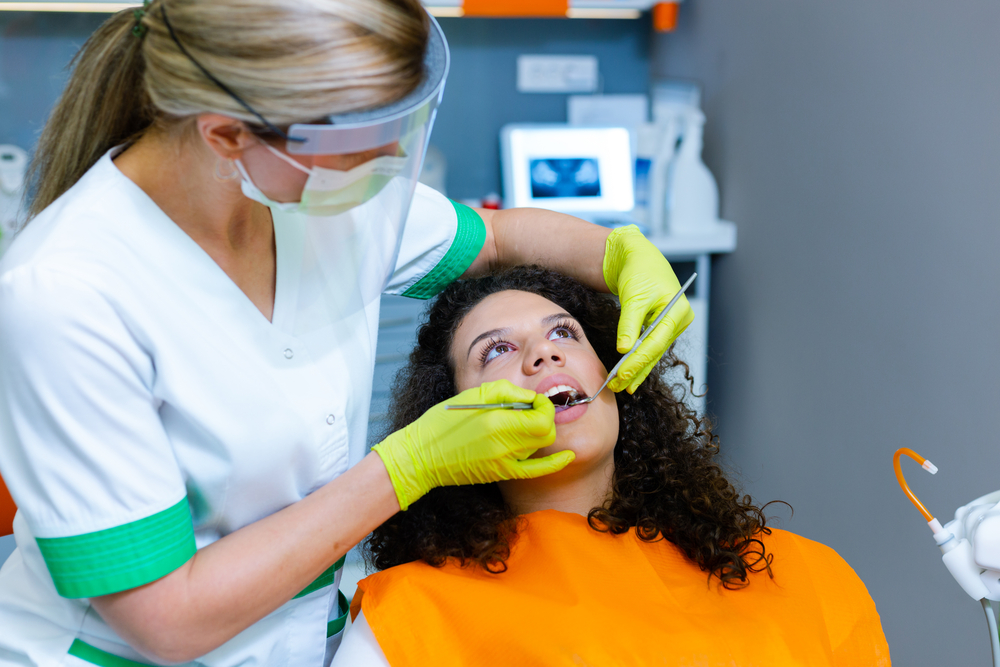 young woman receiving dental exam
