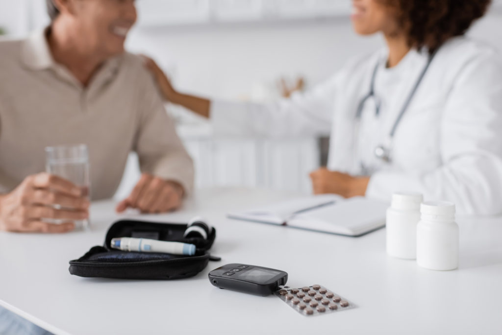 Doctor and patient discussing diabetes care and oral health.