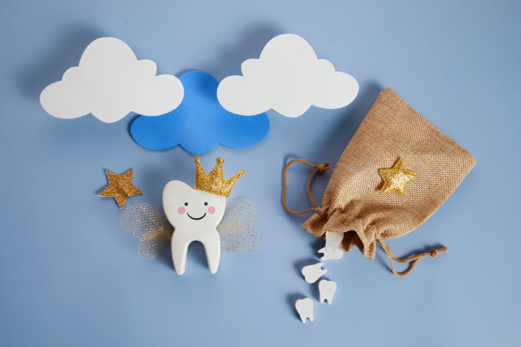 Cute tooth fairy with a bag for lost teeth. 