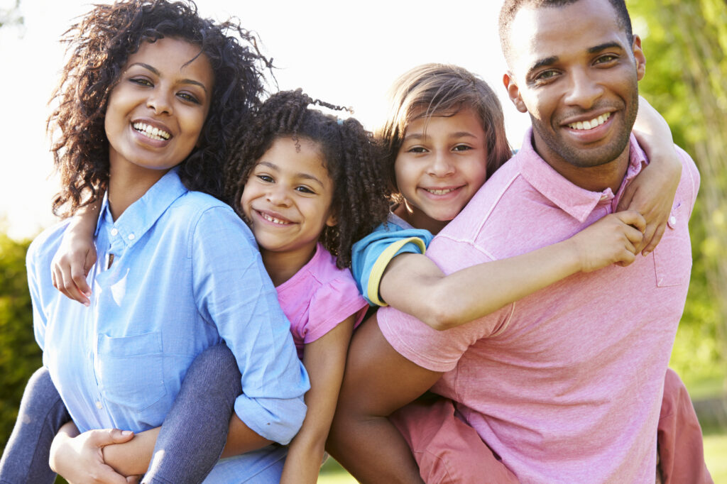 Family with bright, healthy smiles. 