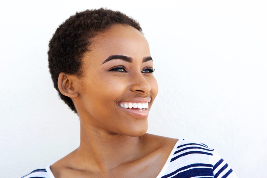 Young woman with bright white smile from Lumineers